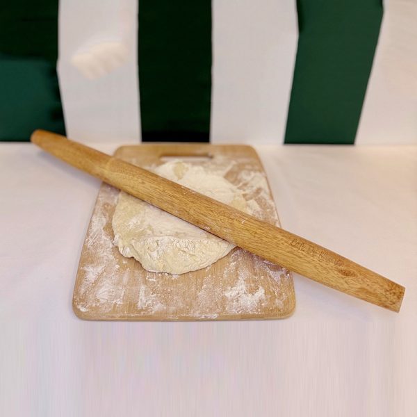 Cafe du Monde Rolling Pin in use kneading dough