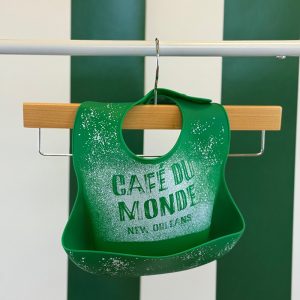 Cafe du Monde Silcon Bib hanging up on a pole