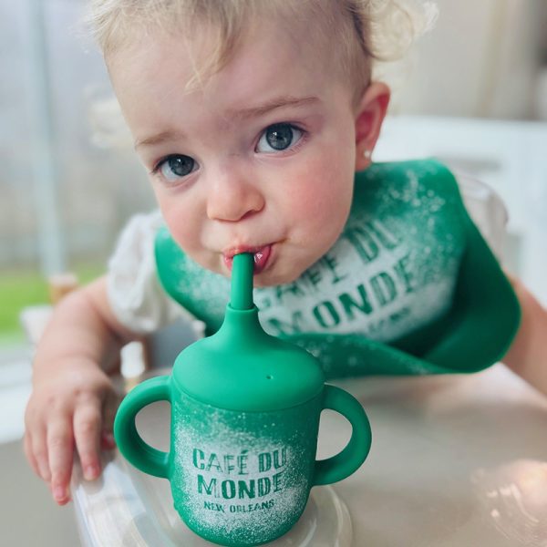 Lane preparing to sip out of his Cafe du Monde New Orleans sippy cup