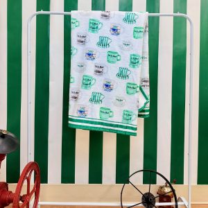 Cafe du Monde Throw Blanket hanging on a towel rack