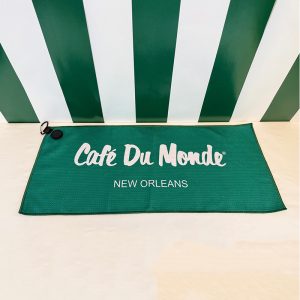Cafe du Monde Golf Towel lying on the floor